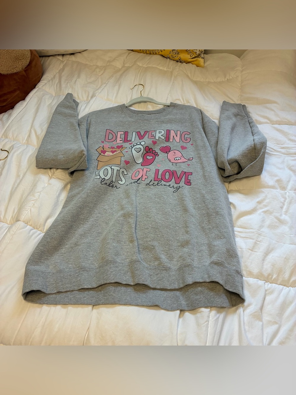 Delivering lots of love labor and delivery nurse sweatshirt